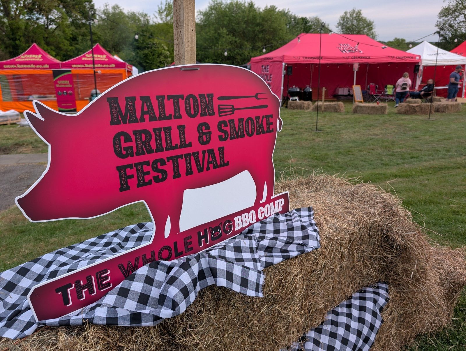 A hand-painted Whole Hog competition sign