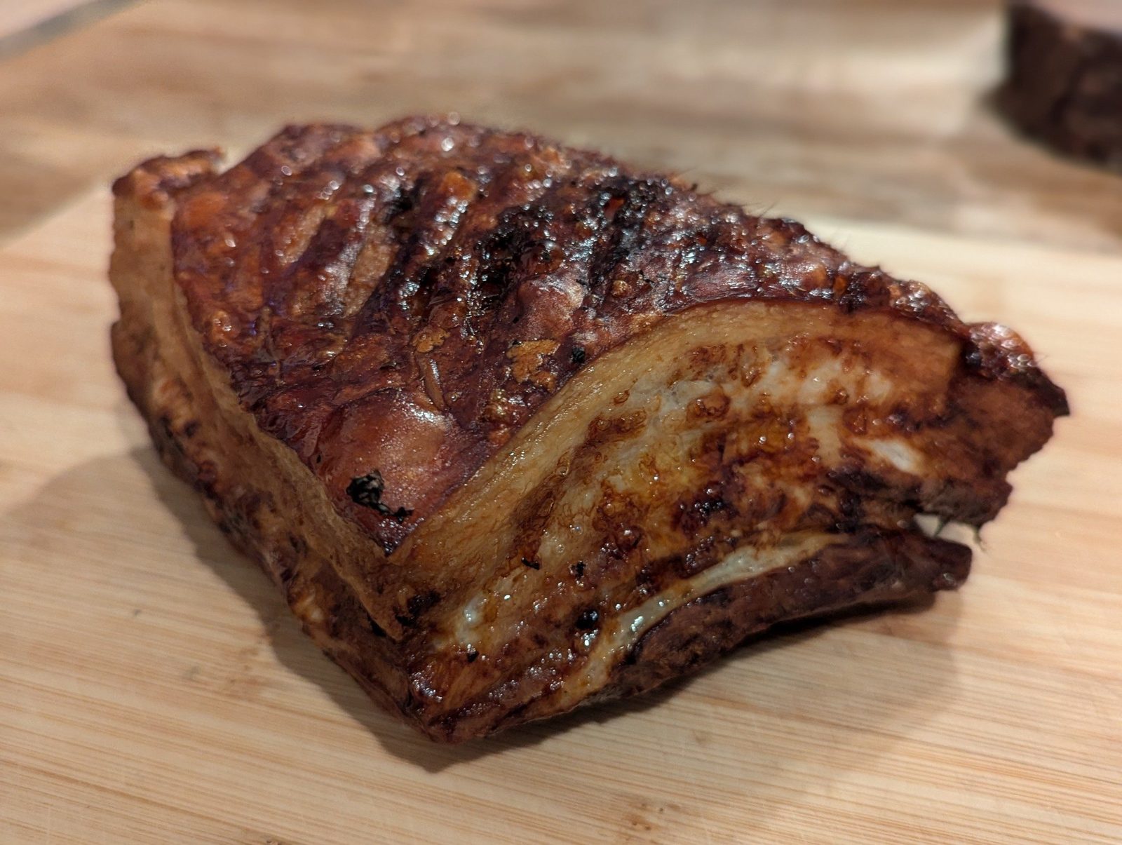 A char-crusted block of competition pork
